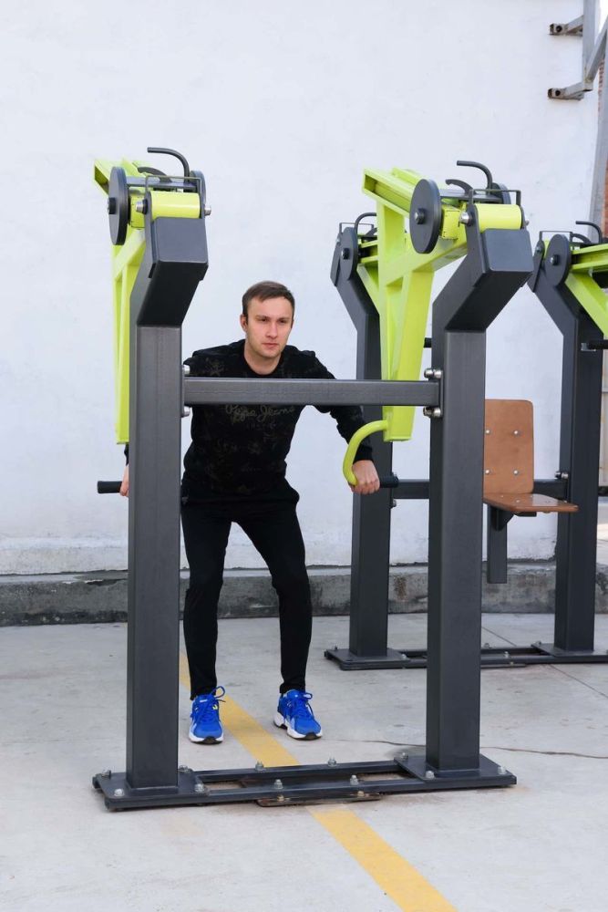Фотографии Уличный тренажер Тяга к поясу стоя с переменной нагрузкой